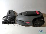 a remote control and a speaker on a table