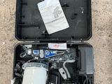 a tool kit in a plastic case on the ground