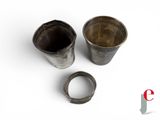 two cups that are sitting next to each other on a table