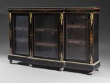 a black and gold decorated cabinet with glass doors