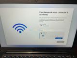 laptop with a wifi sign on it sitting on a table