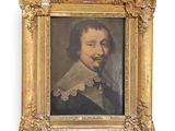 portrait of a man in a gold frame with a white collar