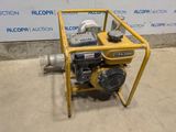 a close up of a small engine on a stand in a room