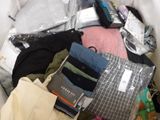 a pile of clothes and other items that are in a bag