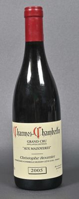 a bottle of wine that is sitting on a table