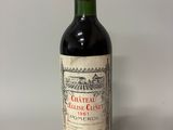 bottle of red wine with a red cap on a white background