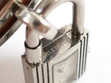 a metal padlock with a key attached to it