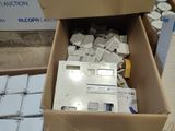 a box full of electronic equipment sitting on the ground