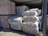 many bags of cement stacked on top of each other
