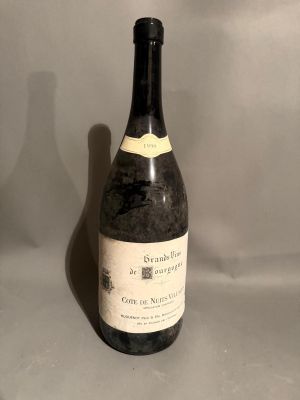a bottle of wine that is sitting on a table