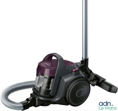 the vacuum is purple and silver with a hose attached to it