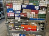a metal cart with many boxes on it in a warehouse