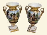 two vases that have been painted with a landscape on them