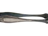 two spoons that are sitting next to each other