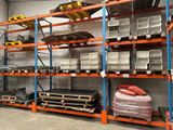 many shelves with various items on them in a warehouse