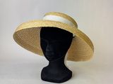 the hat is made of straw and has a white ribbon around the brim