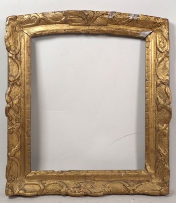 an old gold frame with a decorative design on it