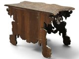 a small wooden table with a wooden top on wheels