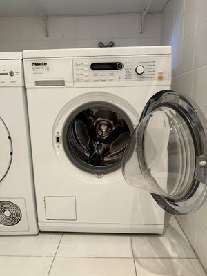 a washer and a dryer in a small room