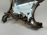 a mirror that is sitting on top of a table