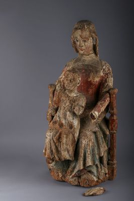 an image of a statue of a woman sitting on a chair