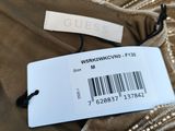 a close up of a label on a dress on a hanger