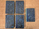 four blue books sitting on top of a wooden table