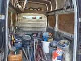 a van with tools in the back of it
