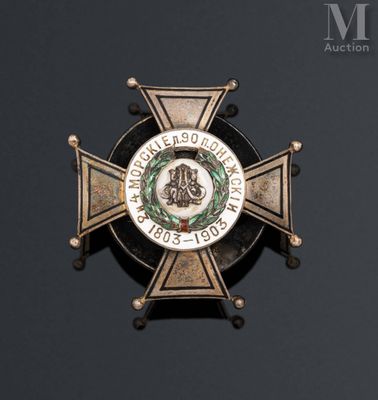 a badge on the back of a badge on a black background