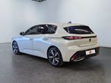 the rear end of a white car in a white room