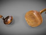 two wooden spoons and a wooden spoon on a gray surface