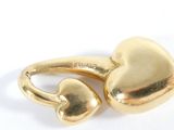 gold plated ring with two heart shaped hearts on it