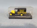 a yellow and black toy truck in a clear case