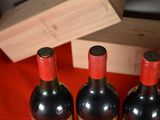 three bottles of wine sitting next to each other on a table