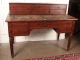 an old wooden desk with drawers and drawers on top of it