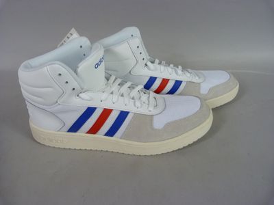 a pair of white sneakers with blue, red and white stripes