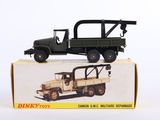 a toy truck with a crane on top of it in a box