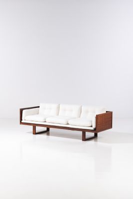 an image of a white couch sitting on top of a white floor