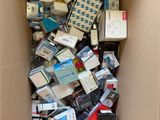 a cardboard box full of electronic devices and electronics