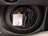 a close up of a car ' s dashboard with tools in it
