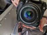 a person holding a camera in their hand