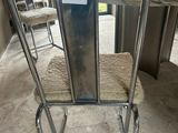 a metal chair that is sitting in front of a table