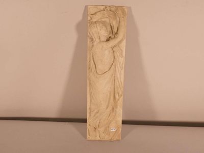 statue of a woman holding a child in her arms on a table