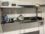 an image of a kitchen with stainless steel counter tops
