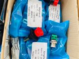a cardboard box with a bunch of blue bags inside of it