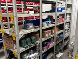 many shelves with various items on them in a warehouse