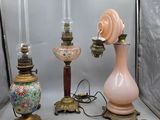three lamps that are sitting next to each other on a table