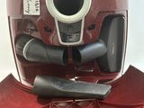 a red helmet with a hole in the middle of it