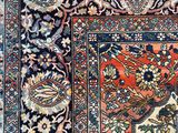 a close up of an oriental rug on a wooden floor