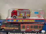 a toy fire truck that is sitting on top of a box